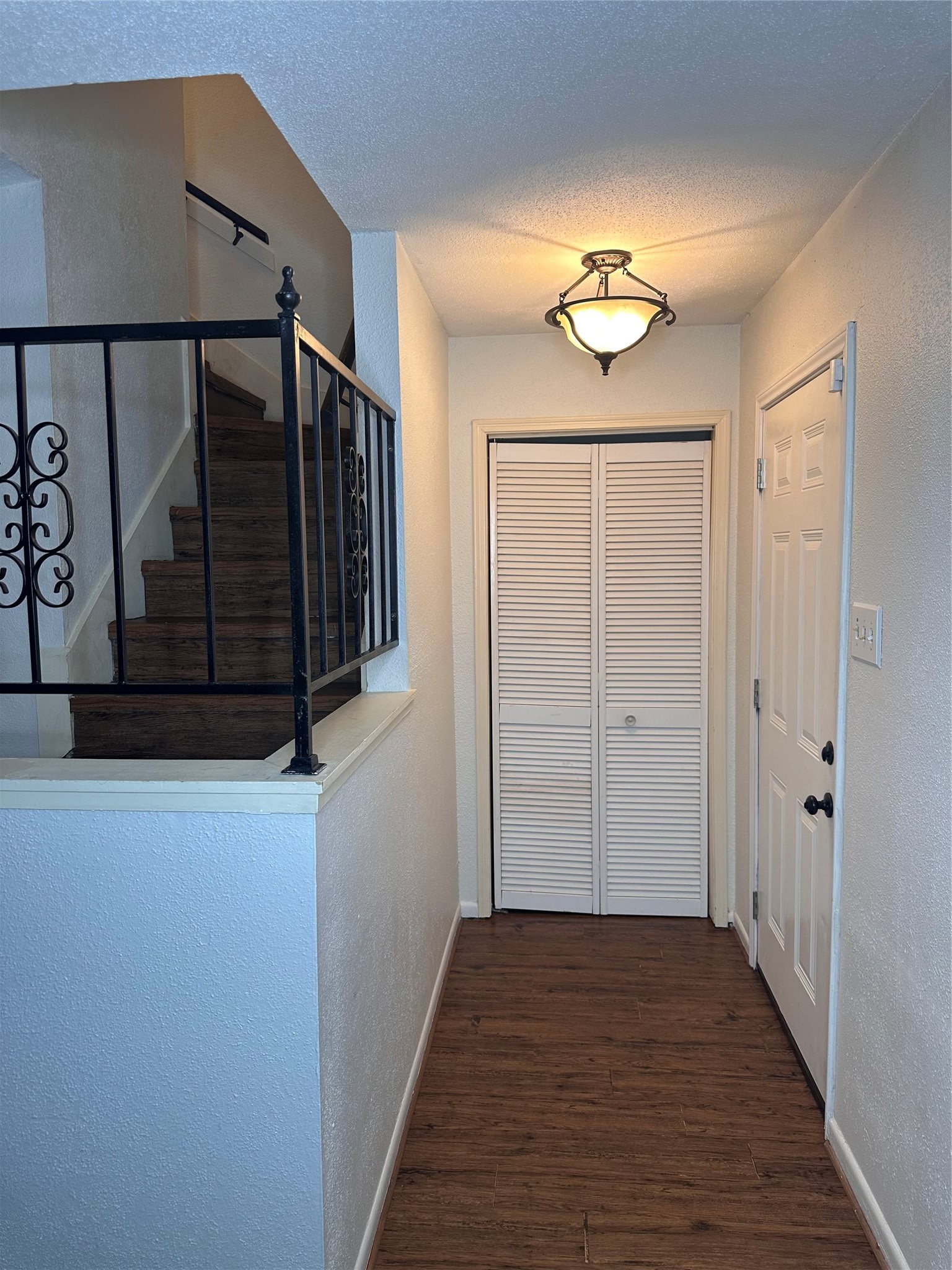 1413 Bonanza Road, Unit 413 Houston, TX 77062 - Photo 12 of 39 a view of a hallway with wooden floor and door