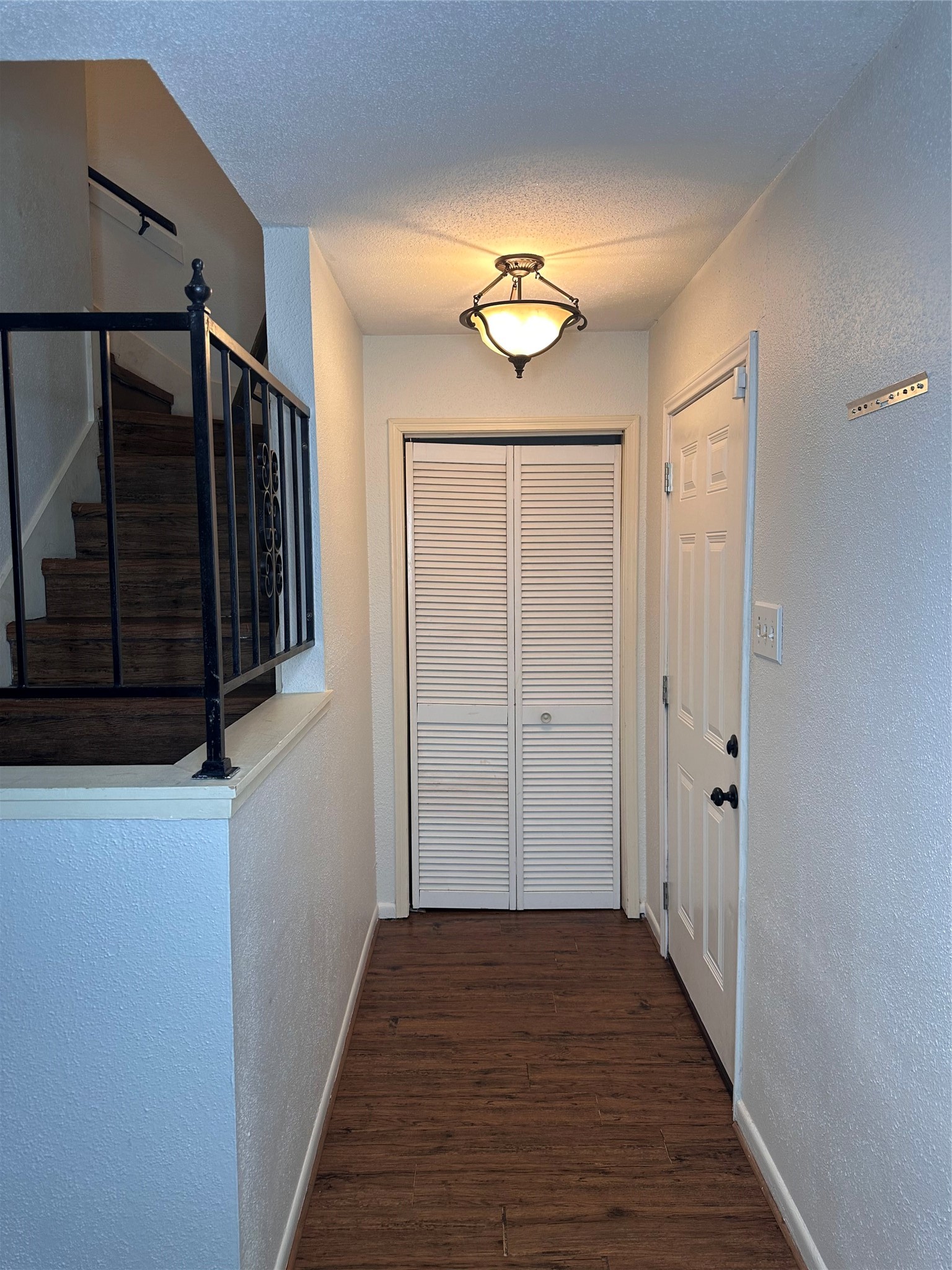 1413 Bonanza Road, Unit 413 Houston, TX 77062 - Photo 13 of 39 a view of a hallway with wooden floor and staircase