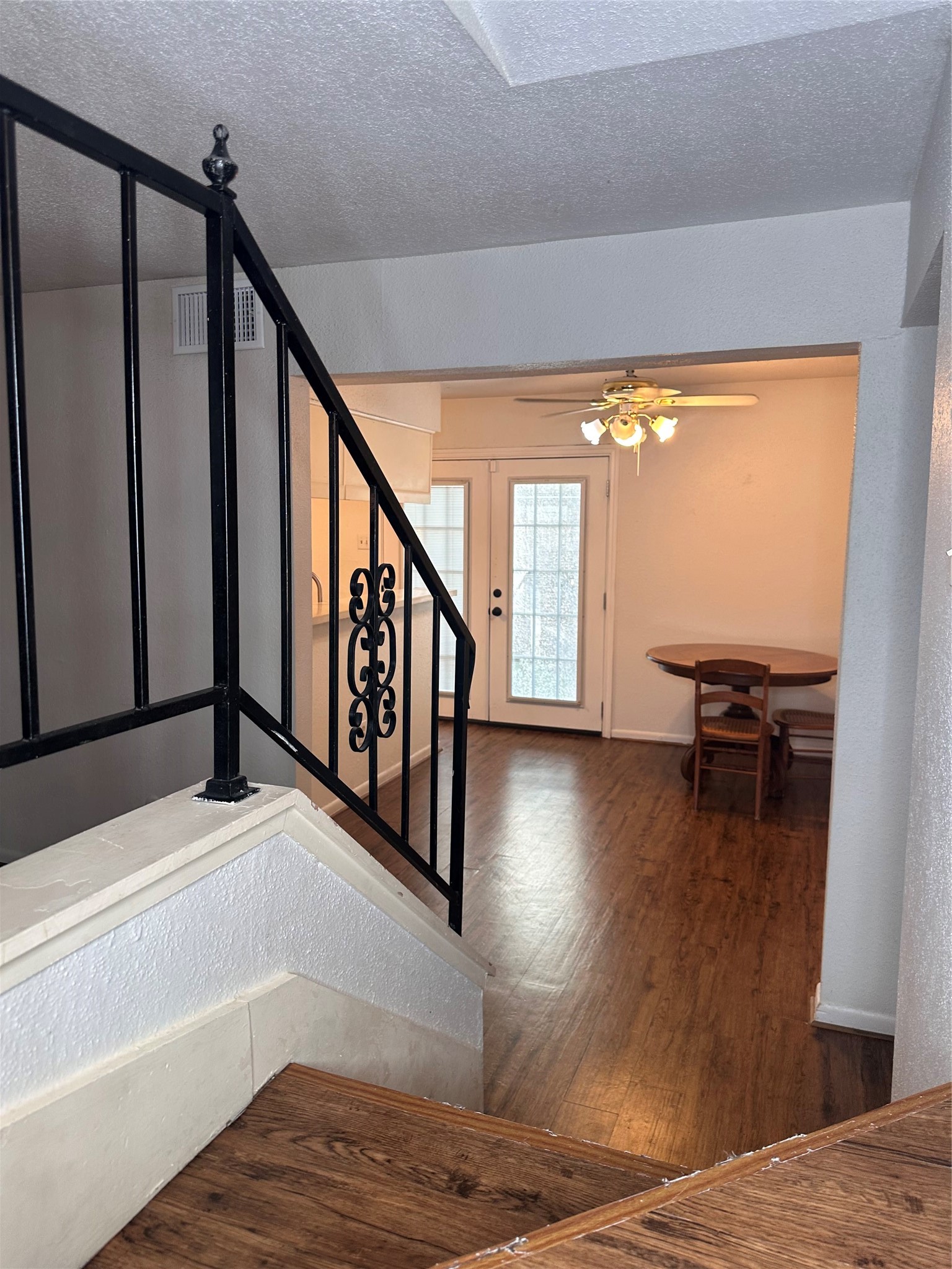 1413 Bonanza Road, Unit 413 Houston, TX 77062 - Photo 14 of 39 a view of a hallway with wooden floor and staircase