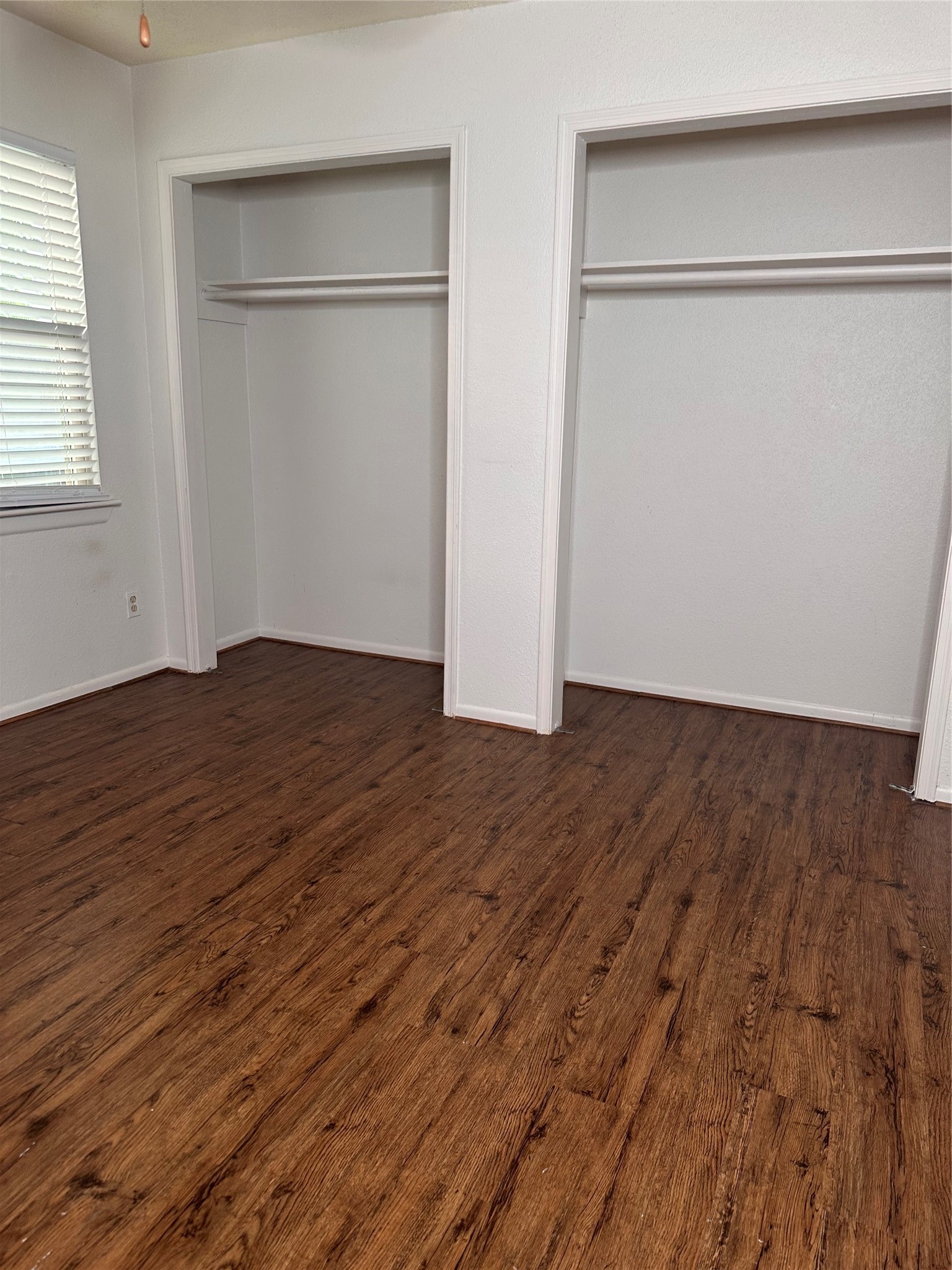 1413 Bonanza Road, Unit 413 Houston, TX 77062 - Photo 26 of 39 an empty room with wooden floor and a window