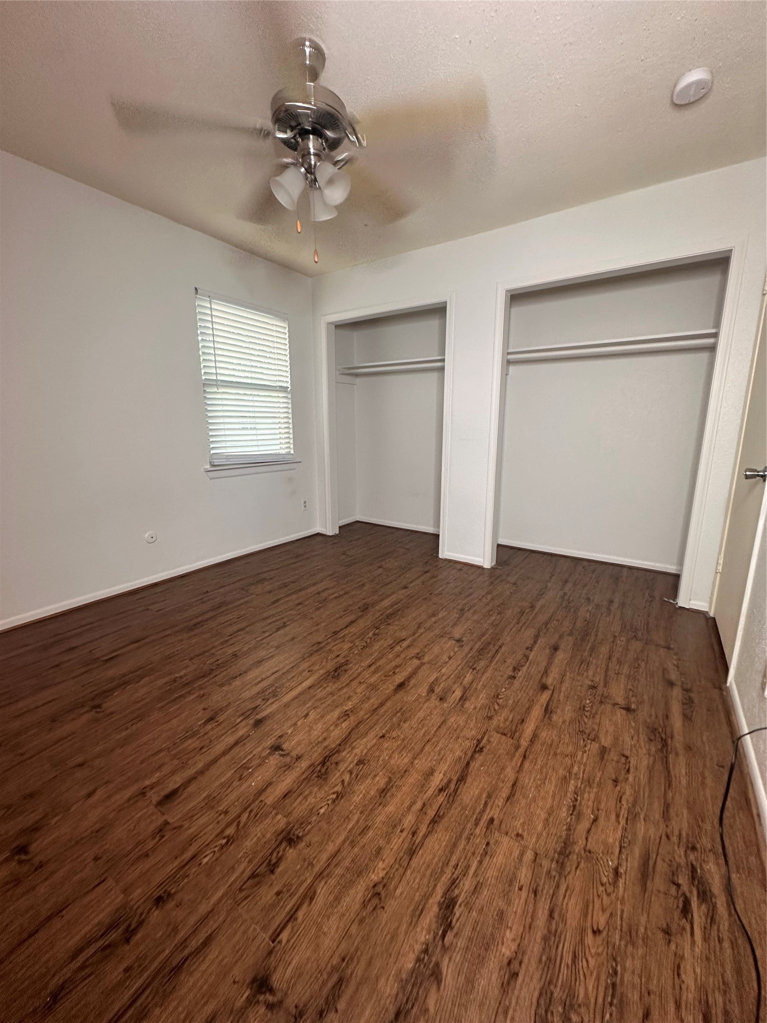 1413 Bonanza Road, Unit 413 Houston, TX 77062 - Photo 27 of 39 a view of empty room with wooden floor and fan