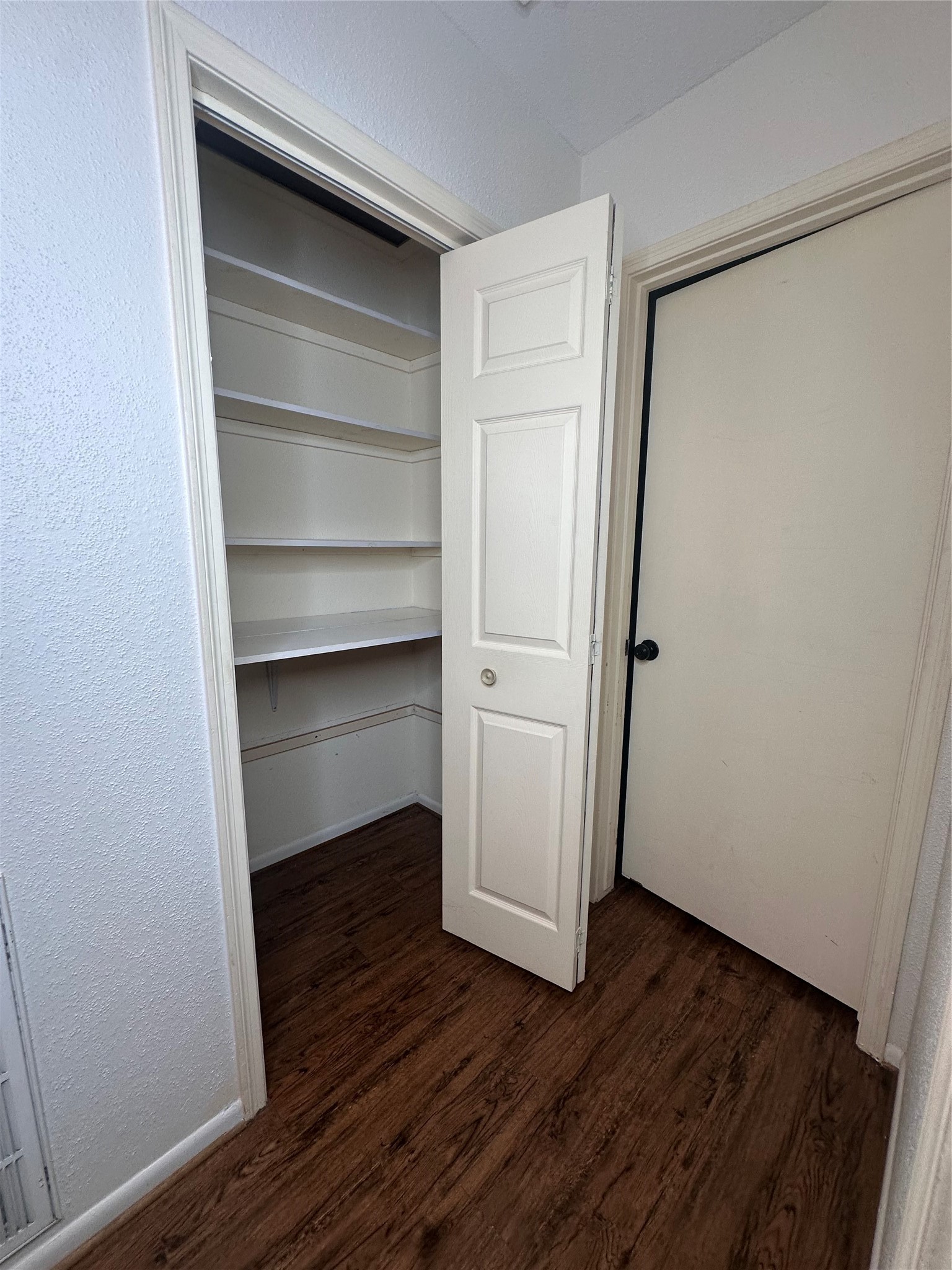 1413 Bonanza Road, Unit 413 Houston, TX 77062 - Photo 30 of 39 a view of walk in closet with wooden floor
