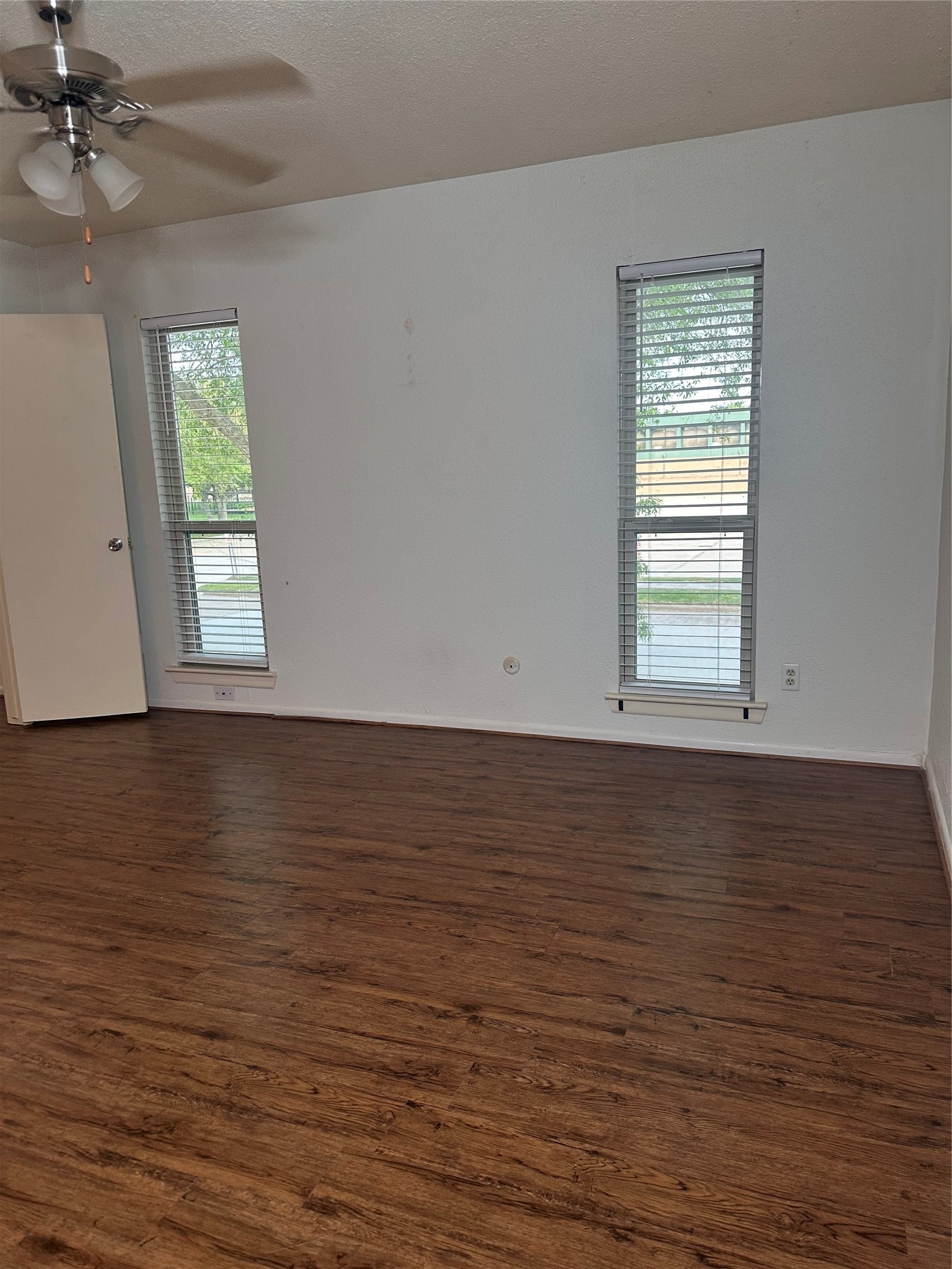 1413 Bonanza Road, Unit 413 Houston, TX 77062 - Photo 34 of 39 an empty room with wooden floor fan and windows