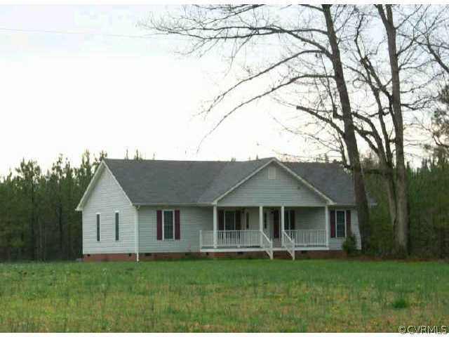 14214 Glebe Road Dewitt, VA 23840 - Photo 1 of 1 a front view of a house with a garden