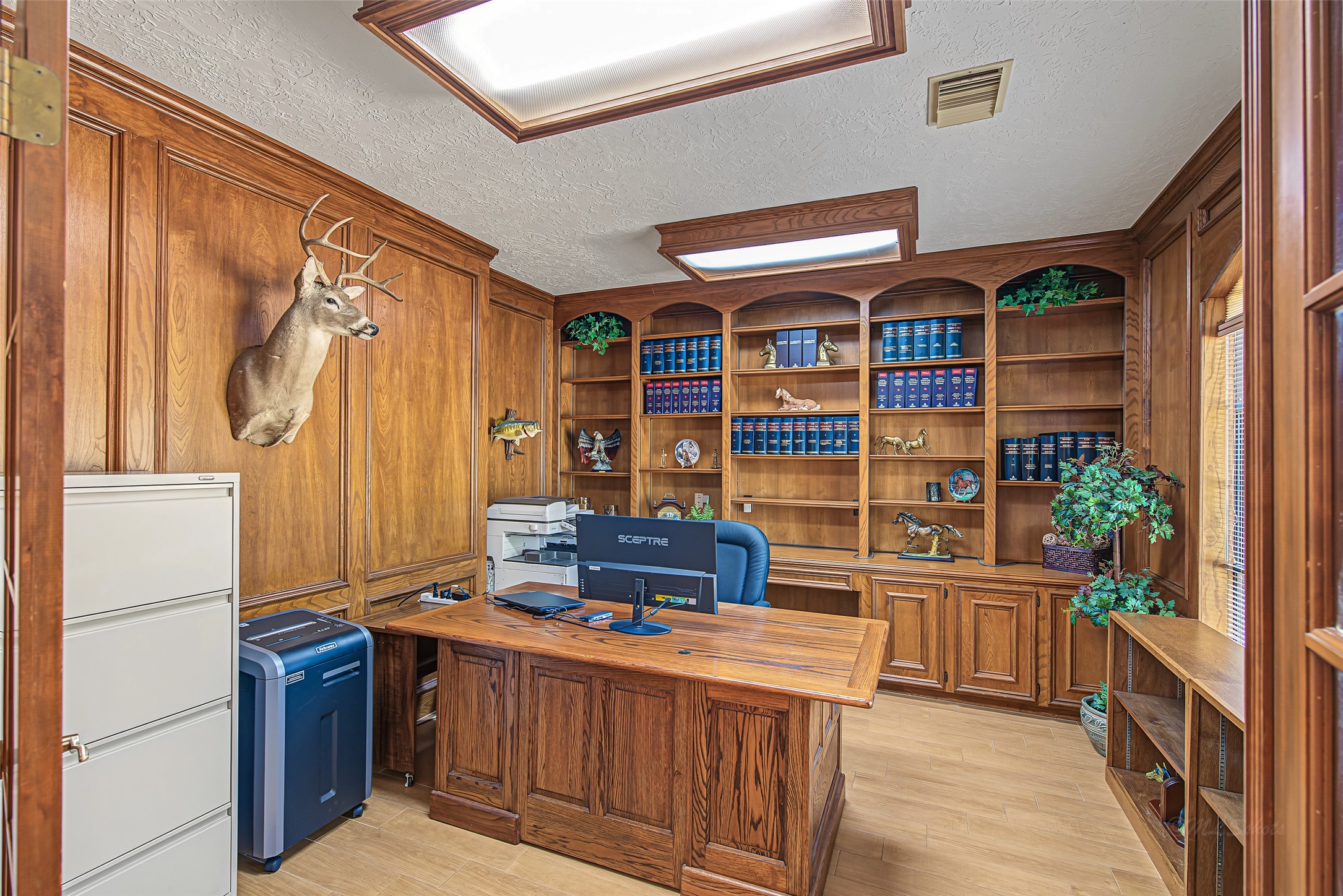 1345 Peach Ridge Road Brookshire, TX 77423 - Photo 9 of 50 This private study is highlighted by floor-to-ceiling custom wood paneling and detailed trim, this room exudes timeless executive style.