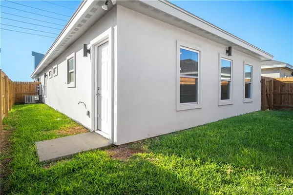 a view of front door and yard