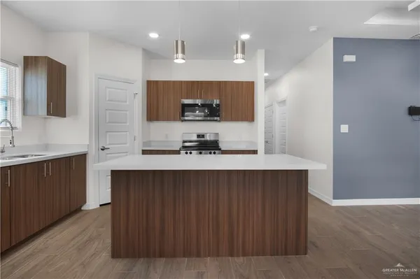 a kitchen with a sink and cabinets