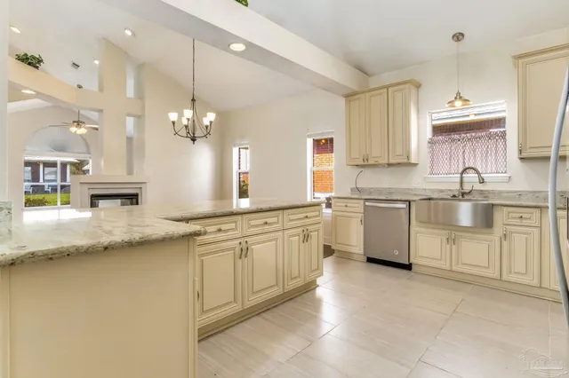 a kitchen with a sink stove and cabinets