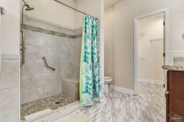 a bathroom with a glass shower door