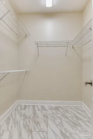 a view of an empty walk in closet