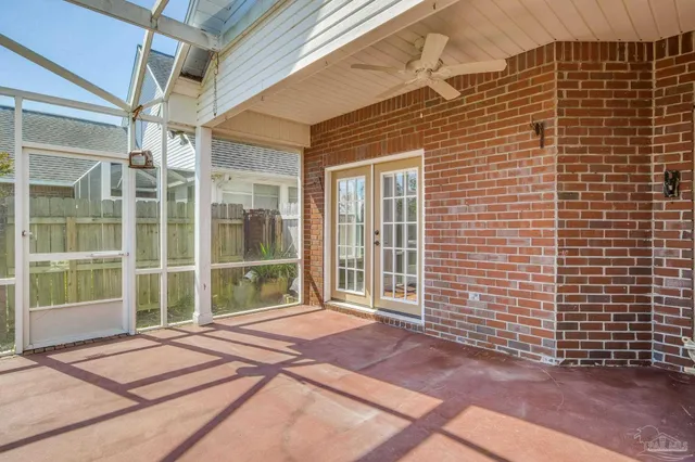 a view of a brick house with a large window