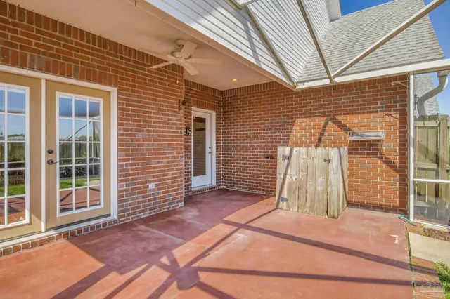 a view of a house with a wooden deck