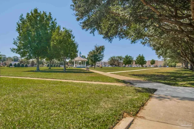a view of a playground with green space