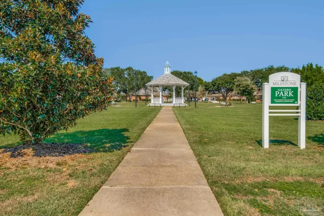 a view of lake with houses in the background