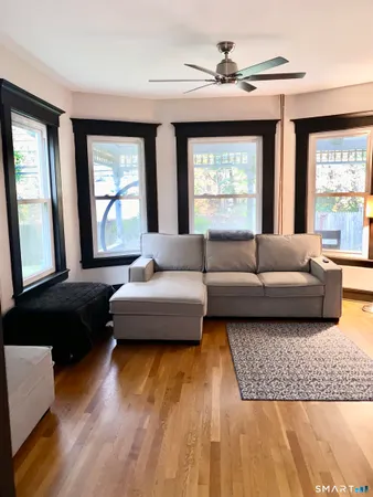 a living room with furniture and a large window