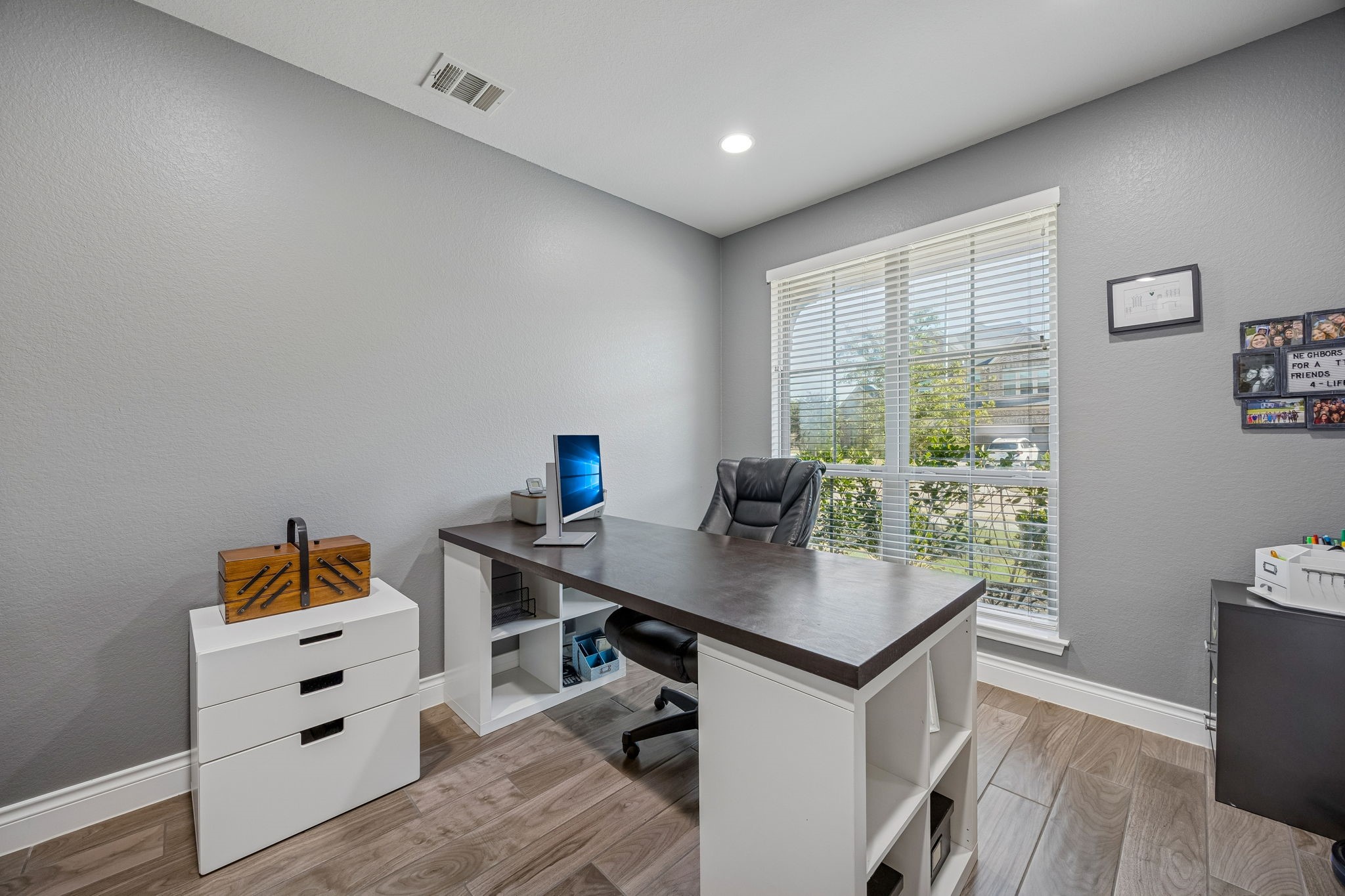 28706 Casen Ranch Lane Fulshear, TX 77441 - Photo 13 of 31 Located to the right of the entry, the dedicated study is secured by elegant double French doors and features elegant flooring and large windows, creating a professional and quiet environment for working from home.