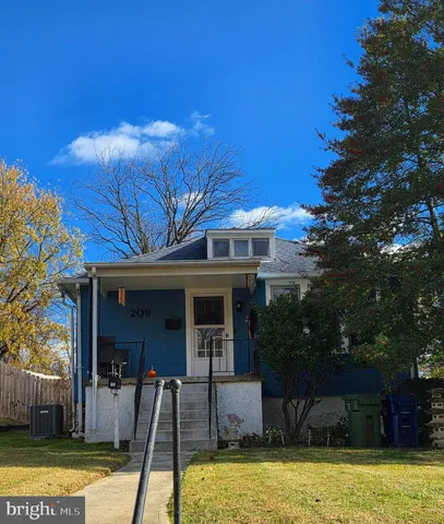 a view of a house with swimming pool and porch