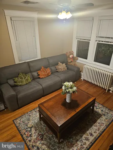 a living room with furniture and a rug