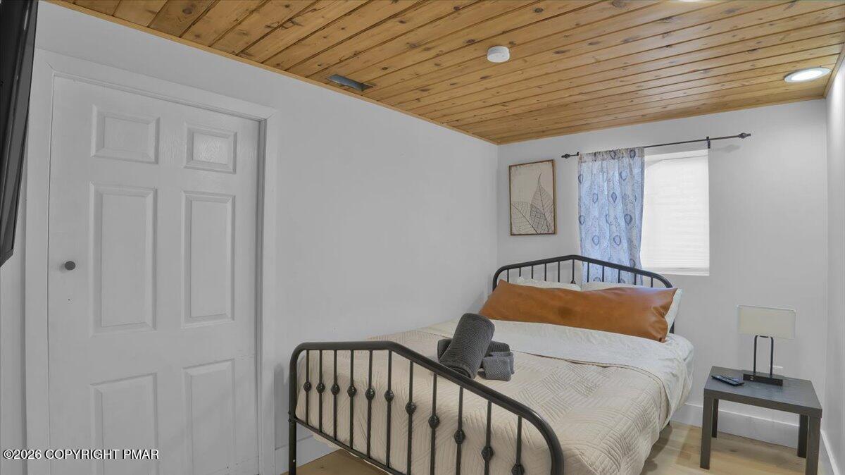 65 Highridge Road Albrightsville, PA 18210 - Photo 15 of 60 a bedroom with a bed and a window
