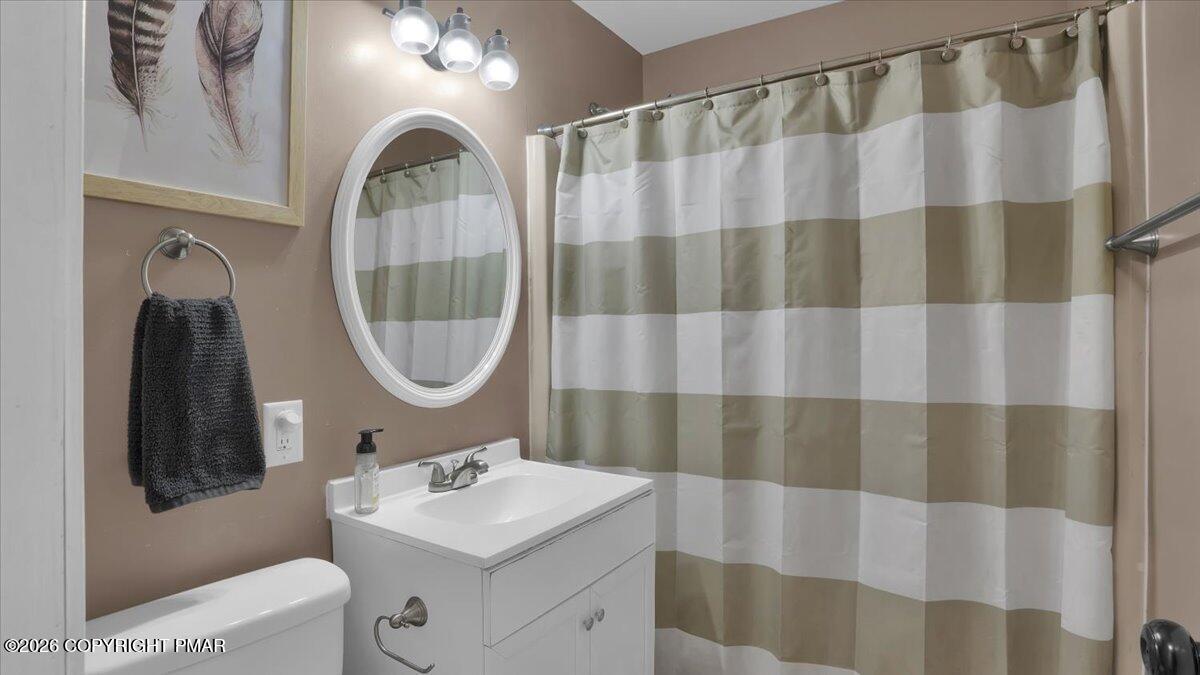 65 Highridge Road Albrightsville, PA 18210 - Photo 18 of 60 a bathroom with a sink a mirror a vanity and a shower