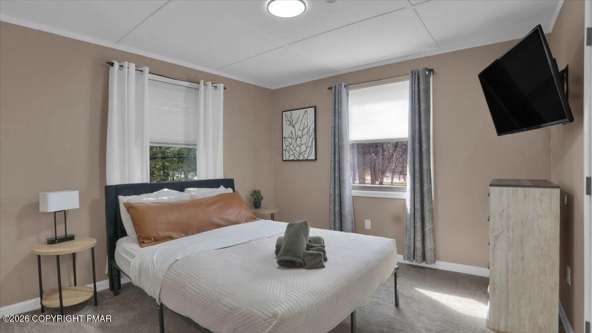 65 Highridge Road Albrightsville, PA 18210 - Photo 19 of 60 a bedroom with a bed and a flat screen tv