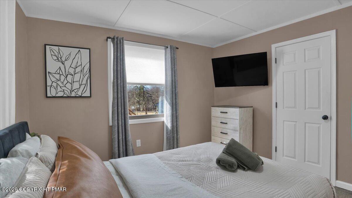 65 Highridge Road Albrightsville, PA 18210 - Photo 20 of 60 a bedroom with a bed and a television