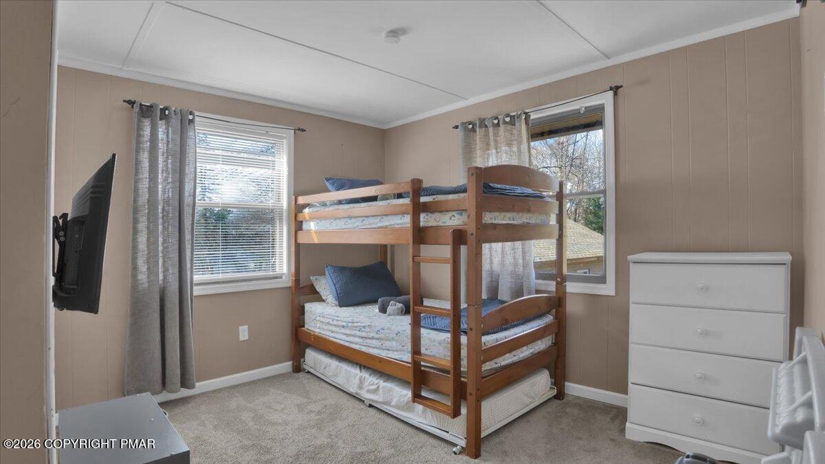65 Highridge Road Albrightsville, PA 18210 - Photo 21 of 60 a bedroom with a bunk bed and a dresser
