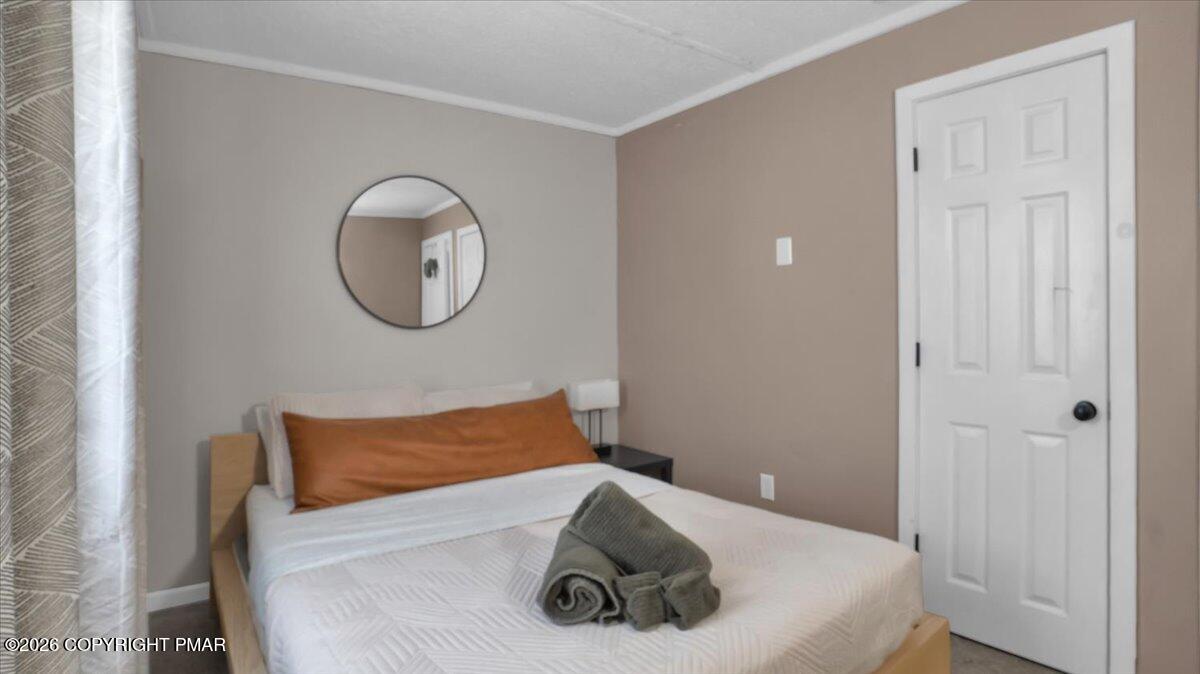 65 Highridge Road Albrightsville, PA 18210 - Photo 24 of 60 a bedroom with a bed and a window