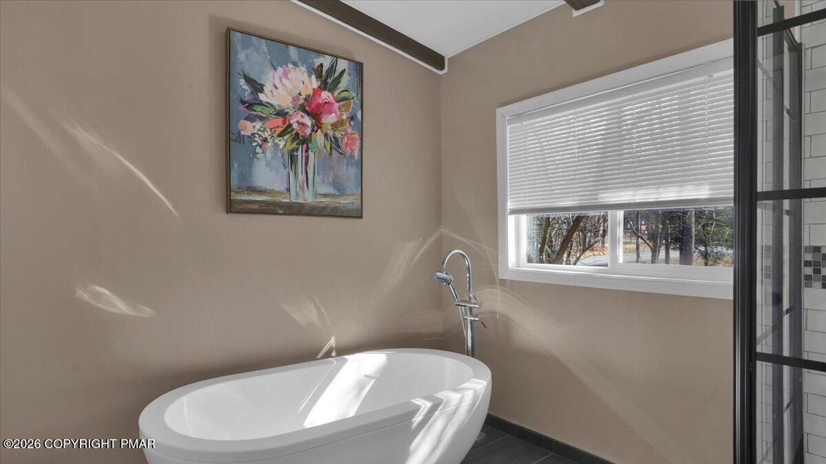 65 Highridge Road Albrightsville, PA 18210 - Photo 28 of 60 a white toilet sitting next to a bathroom sink and tub