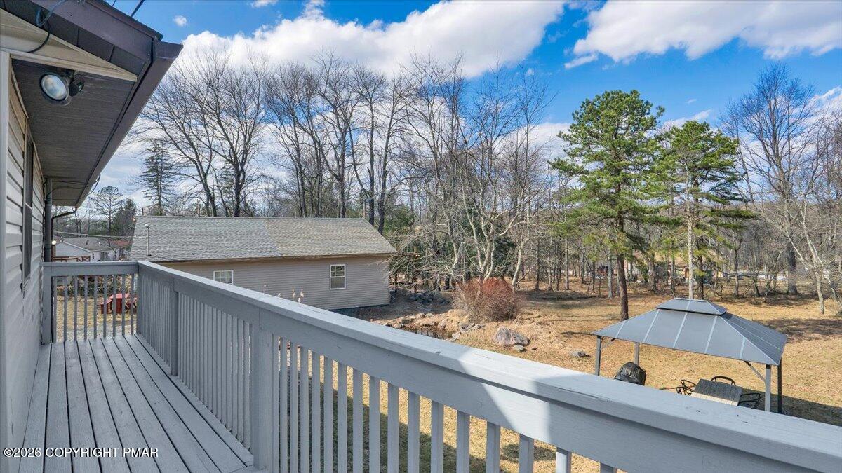 65 Highridge Road Albrightsville, PA 18210 - Photo 30 of 60 a view of a balcony with two chairs and a table