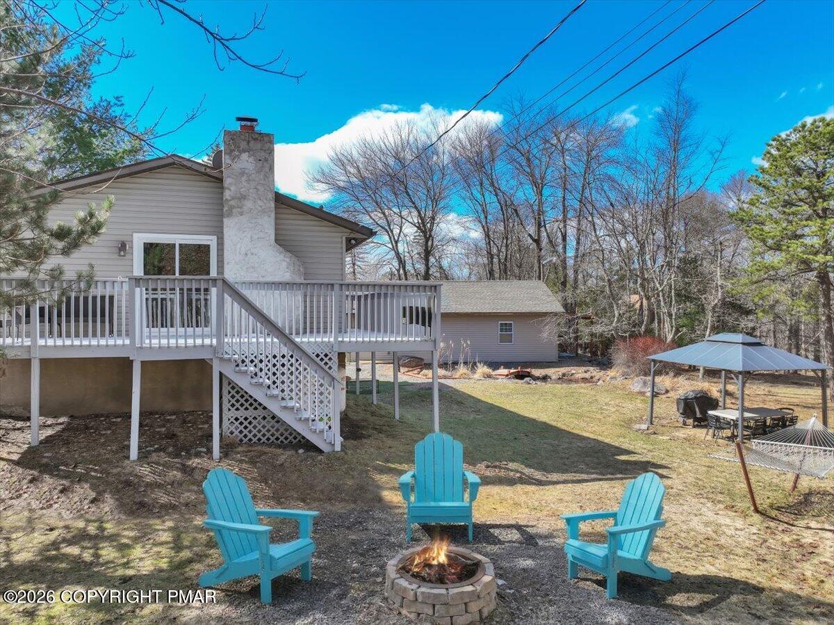 65 Highridge Road Albrightsville, PA 18210 - Photo 45 of 60 a view of a house with backyard and sitting area