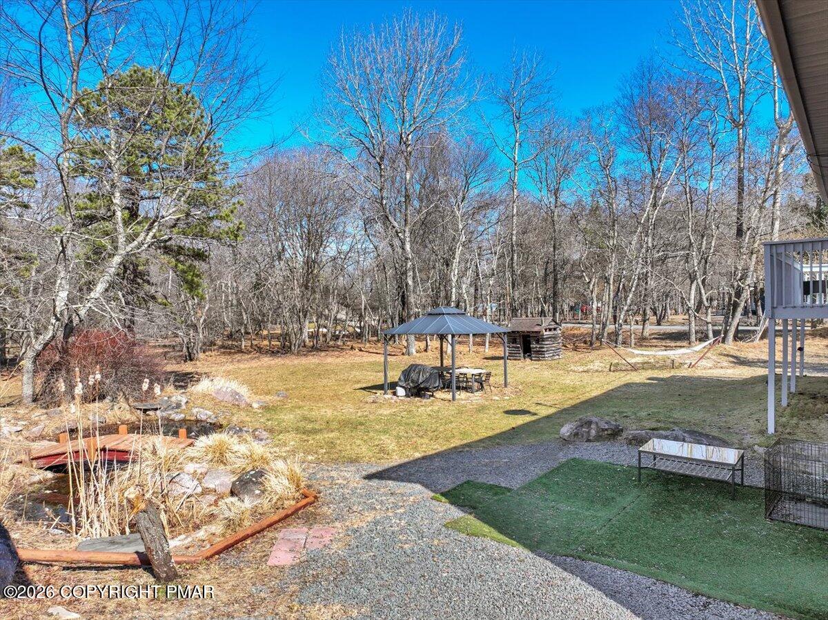65 Highridge Road Albrightsville, PA 18210 - Photo 49 of 60 a view of a swimming pool with an outdoor space and seating area
