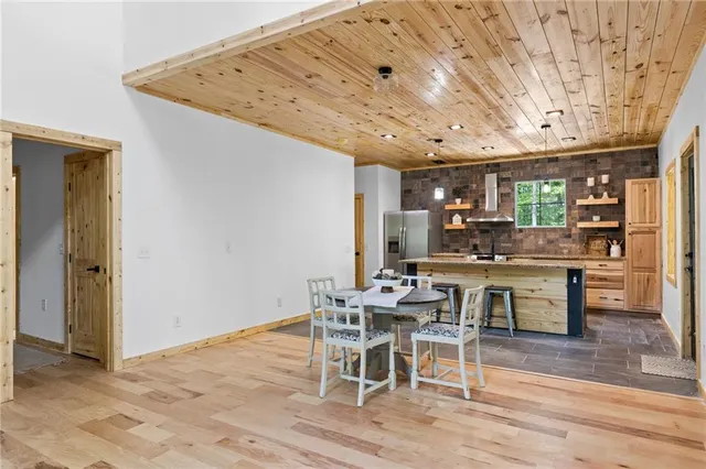 a bedroom with a bed and a ceiling fan