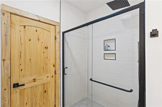 a view of an entryway with wooden floor