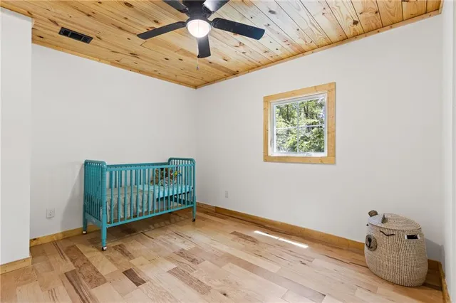 a view of a room with wooden floor
