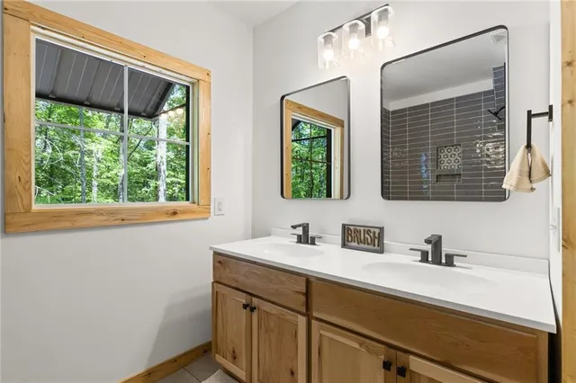 a bathroom with a bathtub and a shower