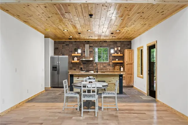 a living room with furniture a fireplace and window