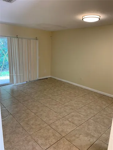 a kitchen with stainless steel appliances granite countertop a refrigerator stove and sink