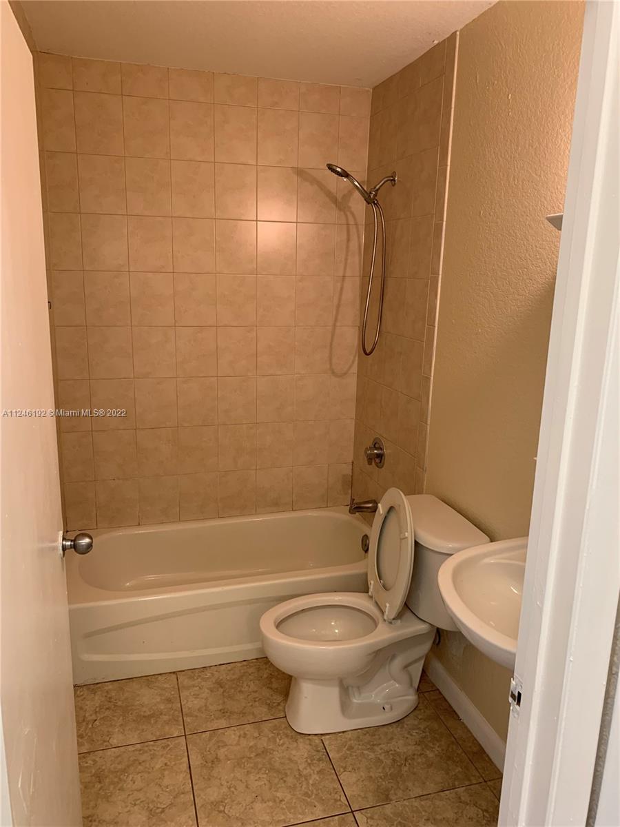 3837 Northwest 76th Way Davie, FL 33024 - Photo 16 of 34 a bathroom with a toilet and a shower