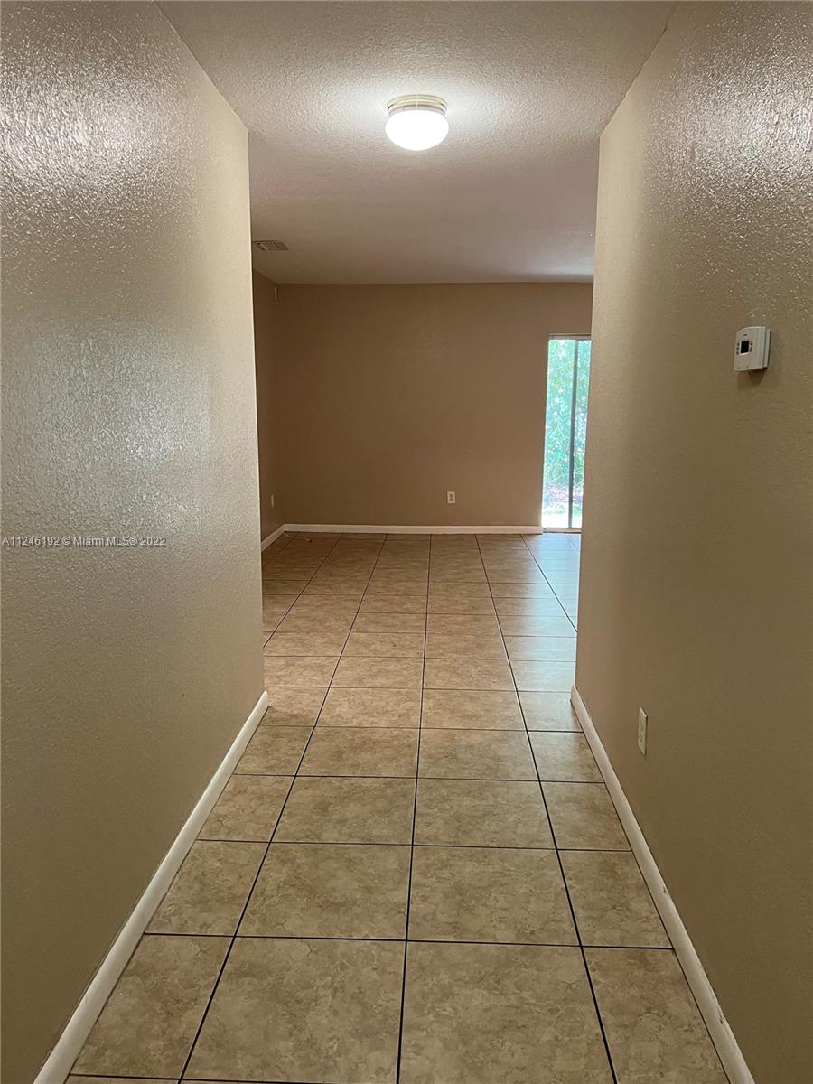 3837 Northwest 76th Way Davie, FL 33024 - Photo 19 of 34 a view of hallway with a window