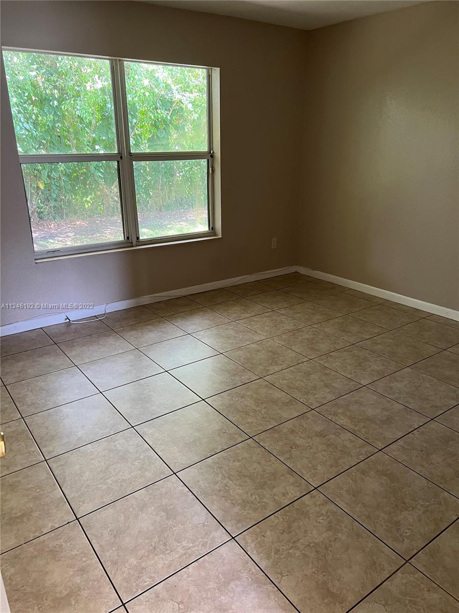 3837 Northwest 76th Way Davie, FL 33024 - Photo 27 of 34 a view of a room and window