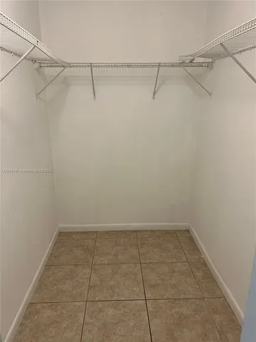 a view of street with parked cars