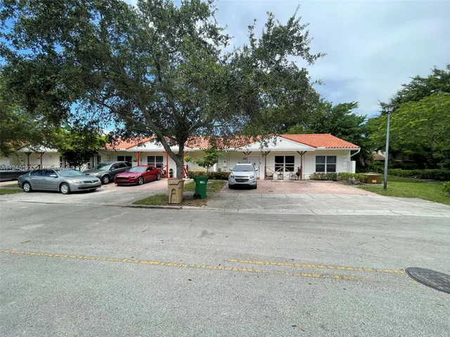 a view of street with parked cars