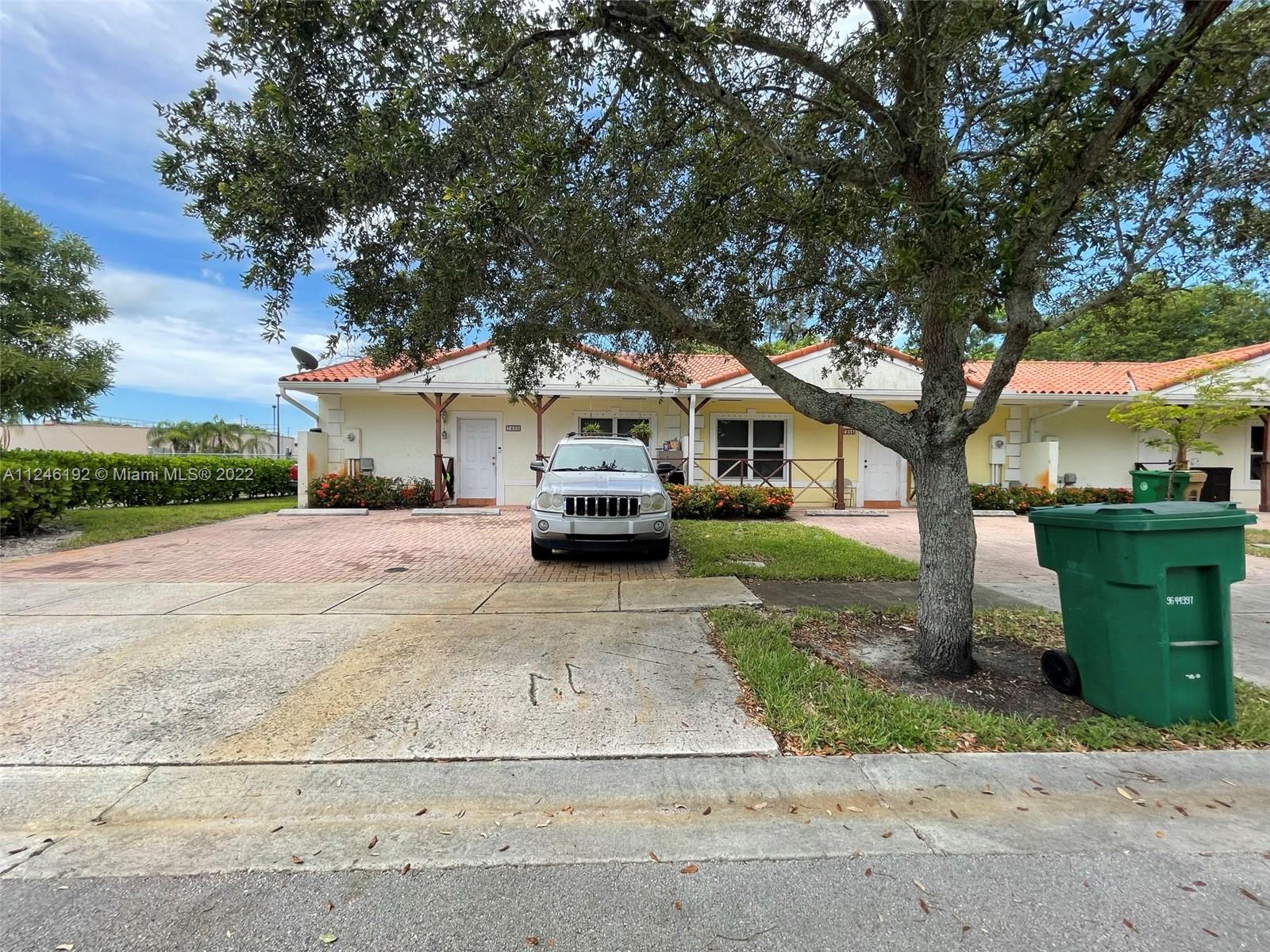 3837 Northwest 76th Way Davie, FL 33024 - Photo 32 of 34 a front view of a house with a yard and garage