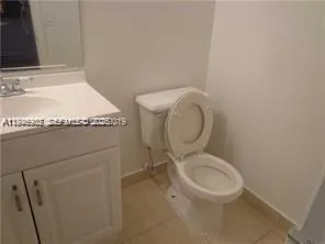 a bathroom with a toilet and a sink