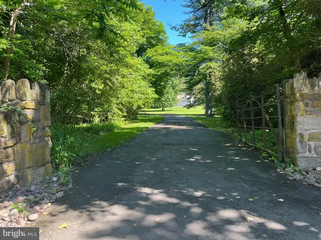a front view of a house with a yard table and chairs