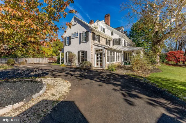 a view of a livingroom with furniture wooden floor and windows