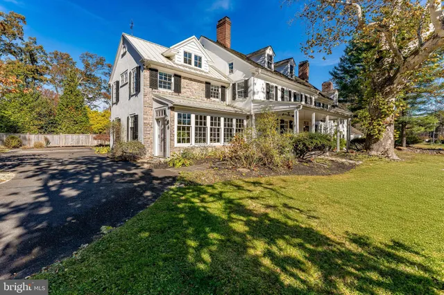 a view of a dining room with furniture wooden floor and chandelier