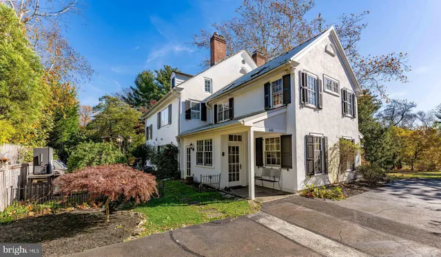 a view of a dining room with furniture a chandelier and wooden floor