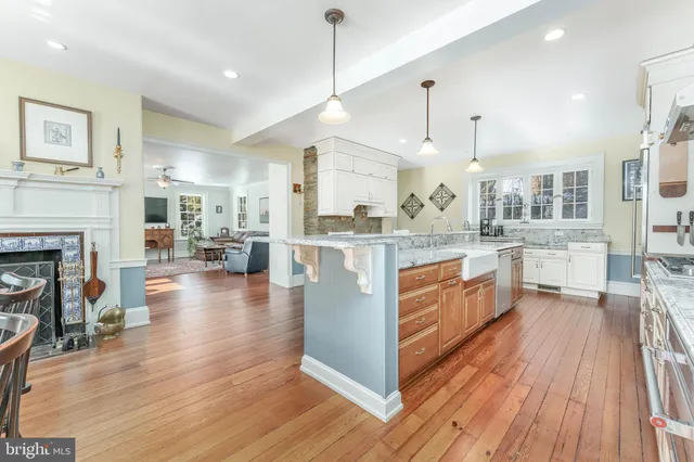 a living room with furniture a rug and a table